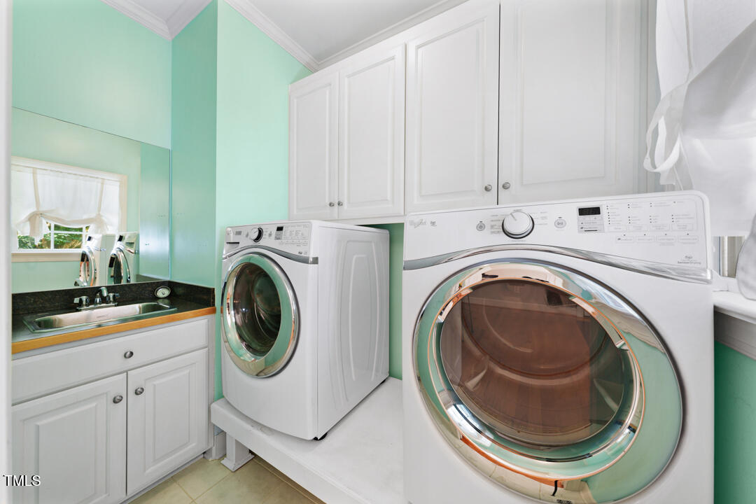745 Oaks Lane Road Timberlake, NC 27583 - Photo 36 of 38 a utility room with sink dryer and washer