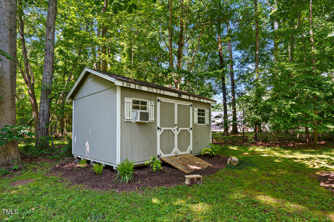 745 Oaks Lane Road Timberlake, NC 27583 - Photo 10 of 38 a view of backyard of house with green space