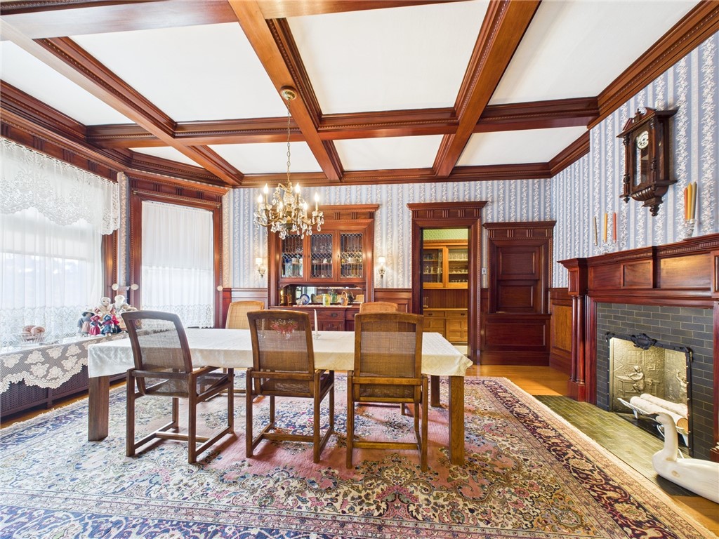 911 West Main Street Smethport, PA 16749 - Photo 21 of 50 Dining room with chandelier and detailed fireplace