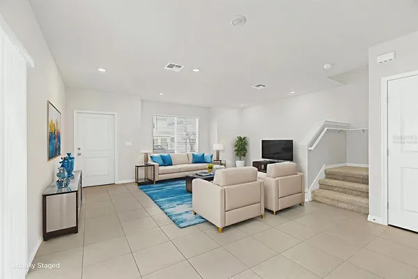 an empty room with white walls and tiles