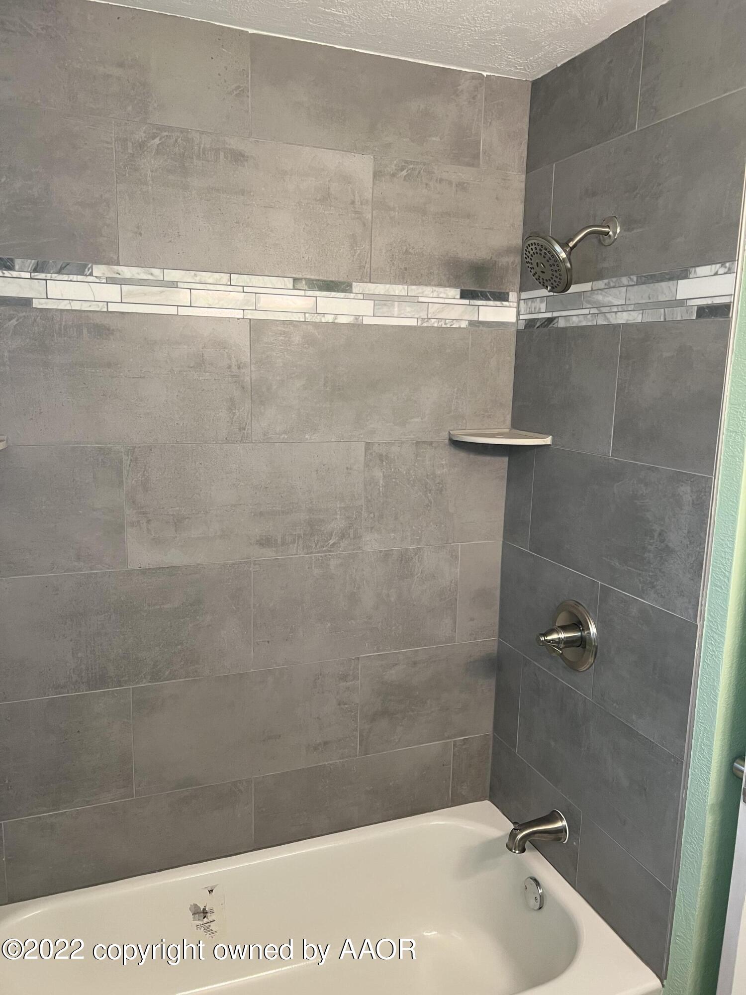 4308 South Ong Street Amarillo, TX 79110 - Photo 8 of 11 a bathroom with a shower