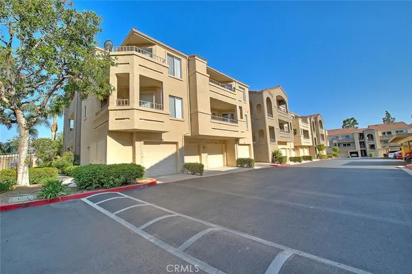 a front view of a house with a street