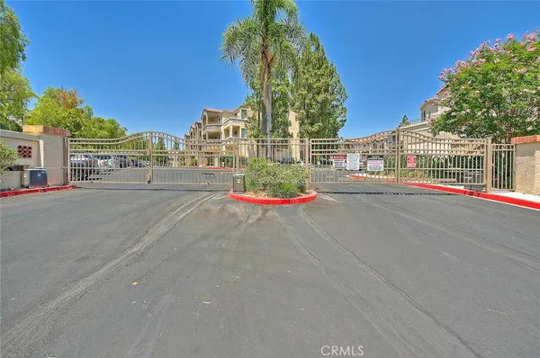 a street view with large buildings and a street view