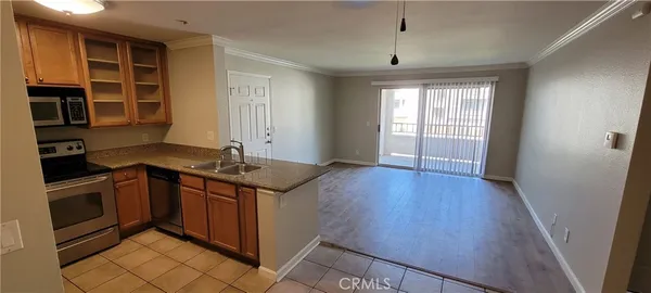 a kitchen with granite countertop a stove and a sink