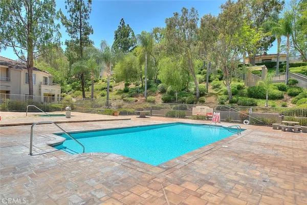 a view of a swimming pool with a lounge chairs