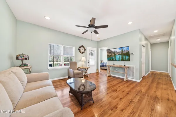 a living room with furniture and a flat screen tv