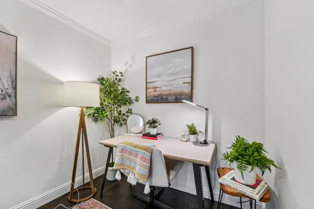 a dining room with furniture and wooden floor