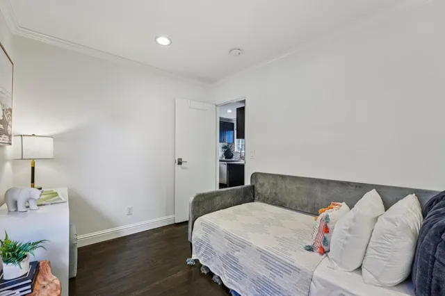 a bedroom with a bed and a couch