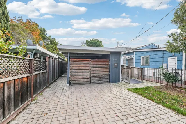 a view of backyard with a garden and deck