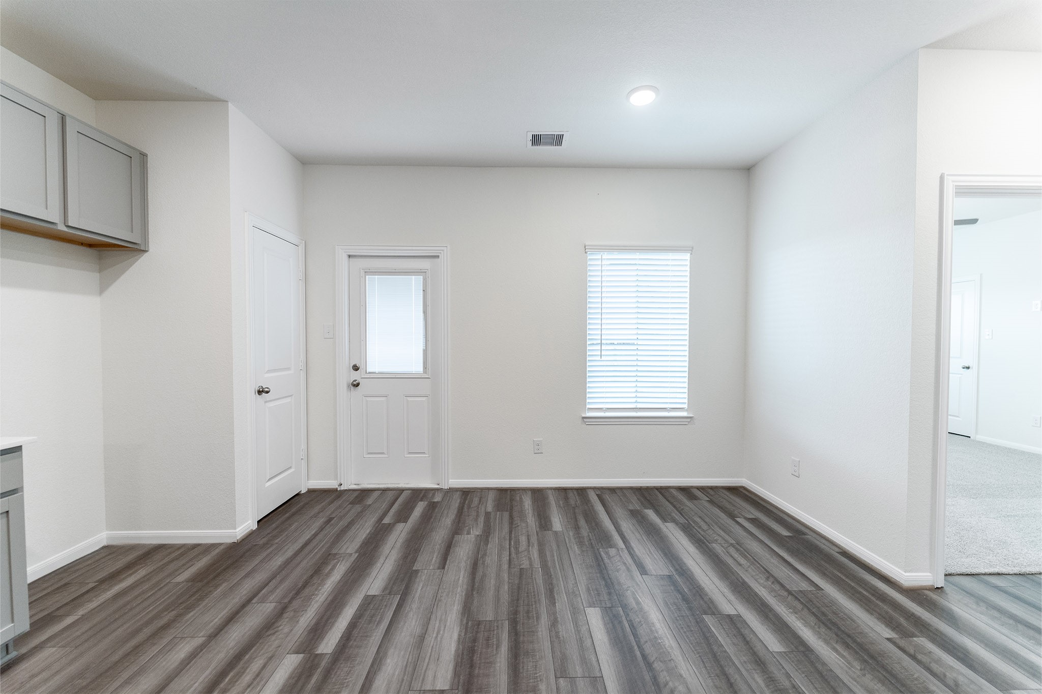 3527 Prairie Rose Trail Angleton, TX 77515 - Photo 6 of 19 a view of a room with wooden floor and window