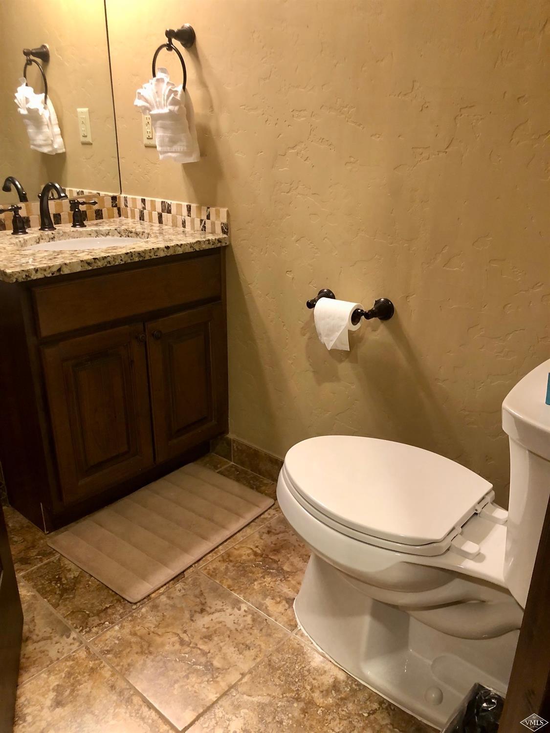 60 County Road, Unit 60A Silverthorne, CO 80497 - Photo 16 of 21 a bathroom with a sink and a toilet