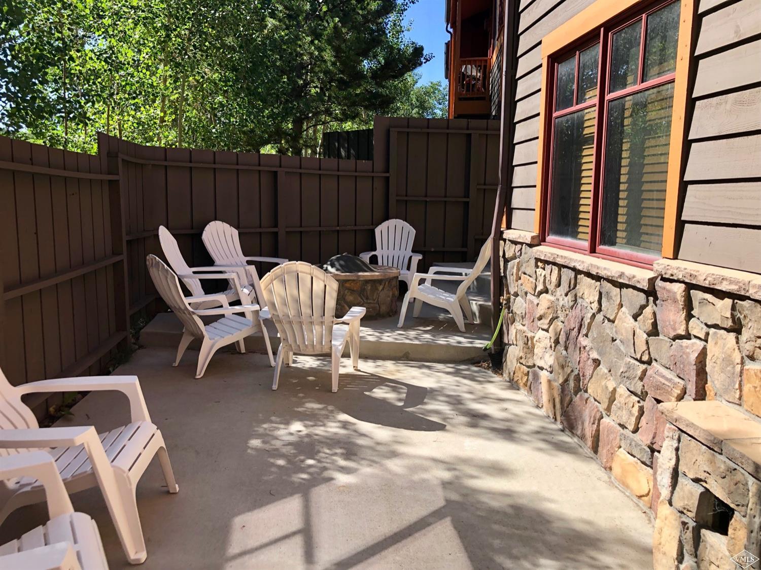 60 County Road, Unit 60A Silverthorne, CO 80497 - Photo 20 of 21 a view of backyard with a table and chairs