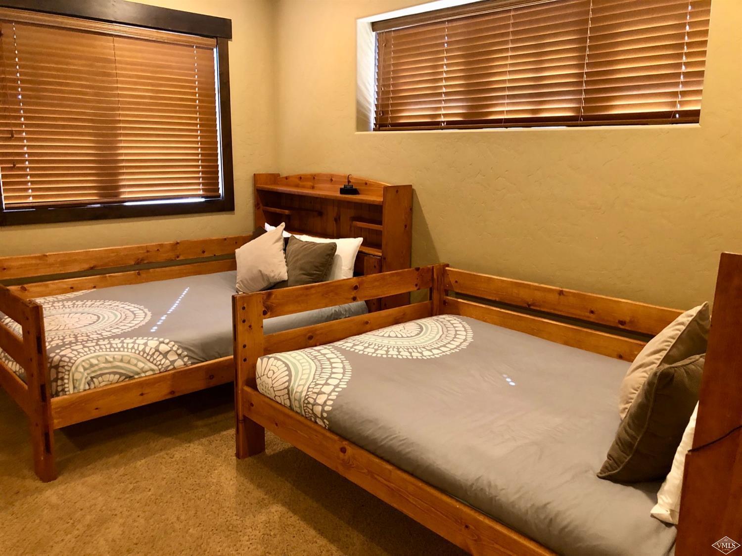 60 County Road, Unit 60A Silverthorne, CO 80497 - Photo 10 of 21 a bedroom with a bed and window