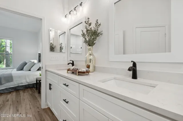 a bathroom with a sink and a mirror