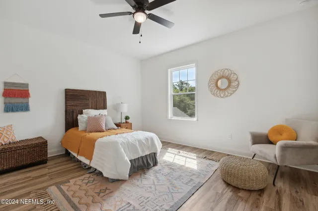 a bedroom with a bed and window
