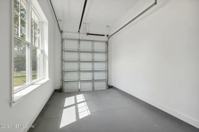 a view of a house with backyard and garden