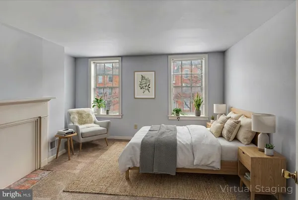 a bedroom with a bed and a couch