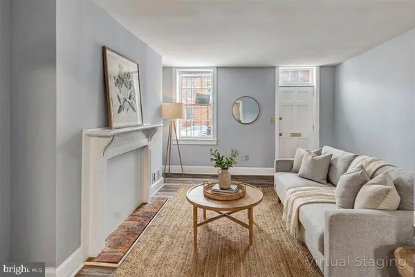a living room with furniture a window and a table