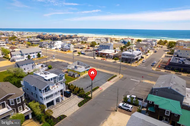 an aerial view of city and ocean