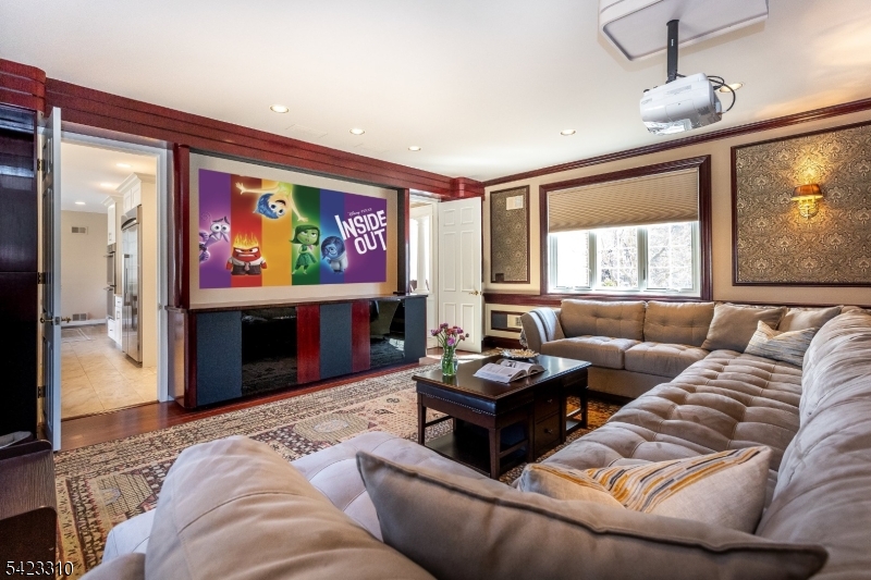 26 Mountain Ridge Drive Livingston, NJ 07039 - Photo 14 of 39 a living room with furniture a large window and a flat screen tv