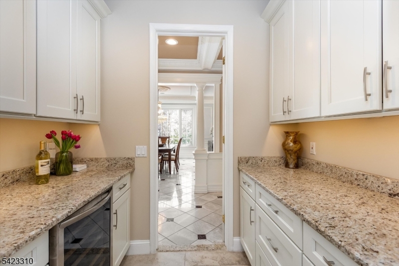 26 Mountain Ridge Drive Livingston, NJ 07039 - Photo 17 of 39 a kitchen with granite countertop cabinets and sink