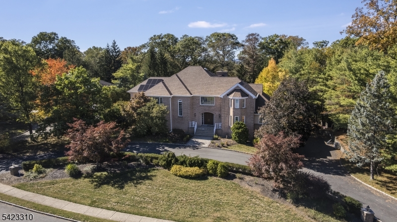26 Mountain Ridge Drive Livingston, NJ 07039 - Photo 2 of 39 a front view of a house with garden