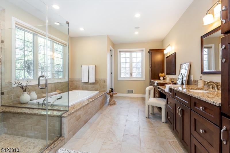 26 Mountain Ridge Drive Livingston, NJ 07039 - Photo 21 of 39 a large spacious bathroom with a large tub and sink