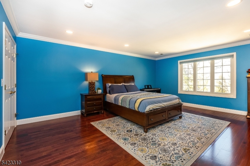 26 Mountain Ridge Drive Livingston, NJ 07039 - Photo 29 of 39 a bedroom with a bed and a window
