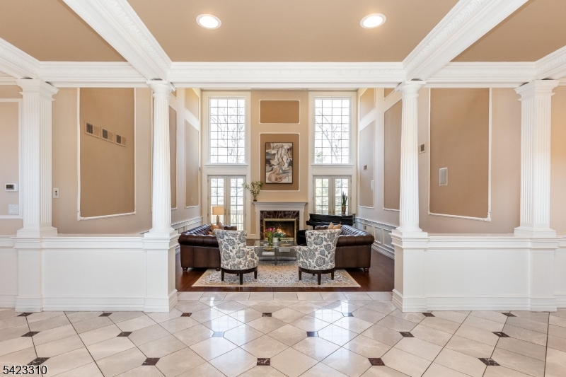 26 Mountain Ridge Drive Livingston, NJ 07039 - Photo 3 of 39 a living room with fireplace furniture and a window