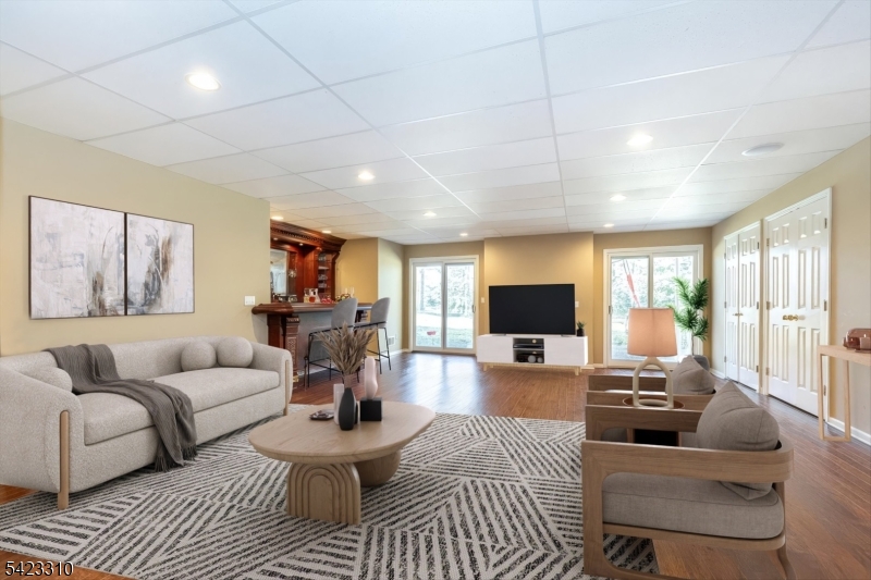 26 Mountain Ridge Drive Livingston, NJ 07039 - Photo 35 of 39 a living room with furniture and a flat screen tv
