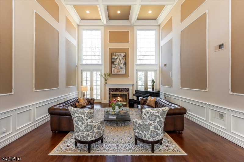 26 Mountain Ridge Drive Livingston, NJ 07039 - Photo 4 of 39 a living room with furniture a fireplace and large windows