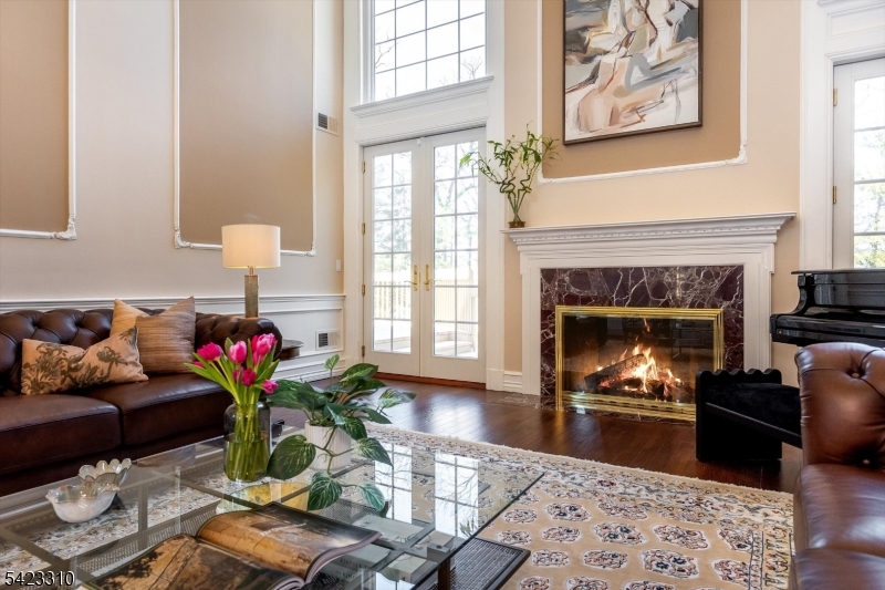 26 Mountain Ridge Drive Livingston, NJ 07039 - Photo 6 of 39 a living room with furniture and a fireplace