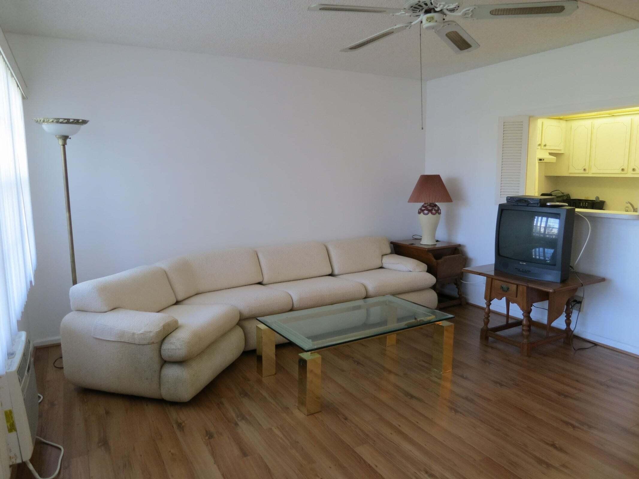 567 Fanshaw North Boca Raton, FL 33434 - Photo 4 of 8 a living room with furniture and a wooden floor