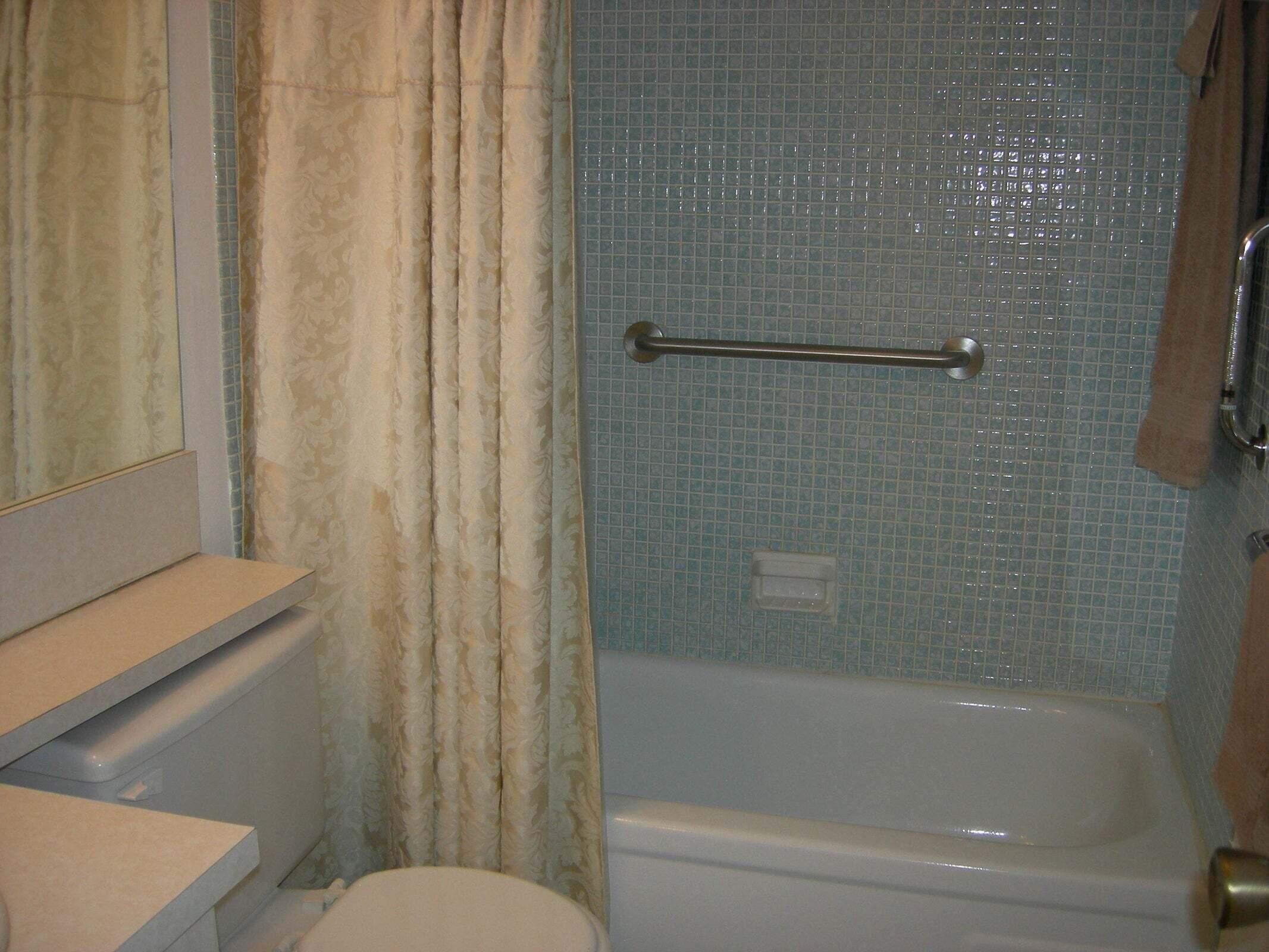 567 Fanshaw North Boca Raton, FL 33434 - Photo 7 of 8 a bathroom with a bathtub and shower