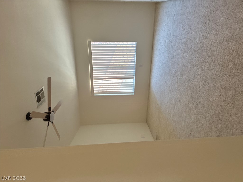 5272 Island Chain Road Las Vegas, NV 89118 - Photo 27 of 39 High ceilings and a well-placed window invite natural light into this versatile loft space.