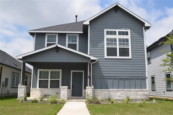 a view of backyard with barbeque grill and wooden fence
