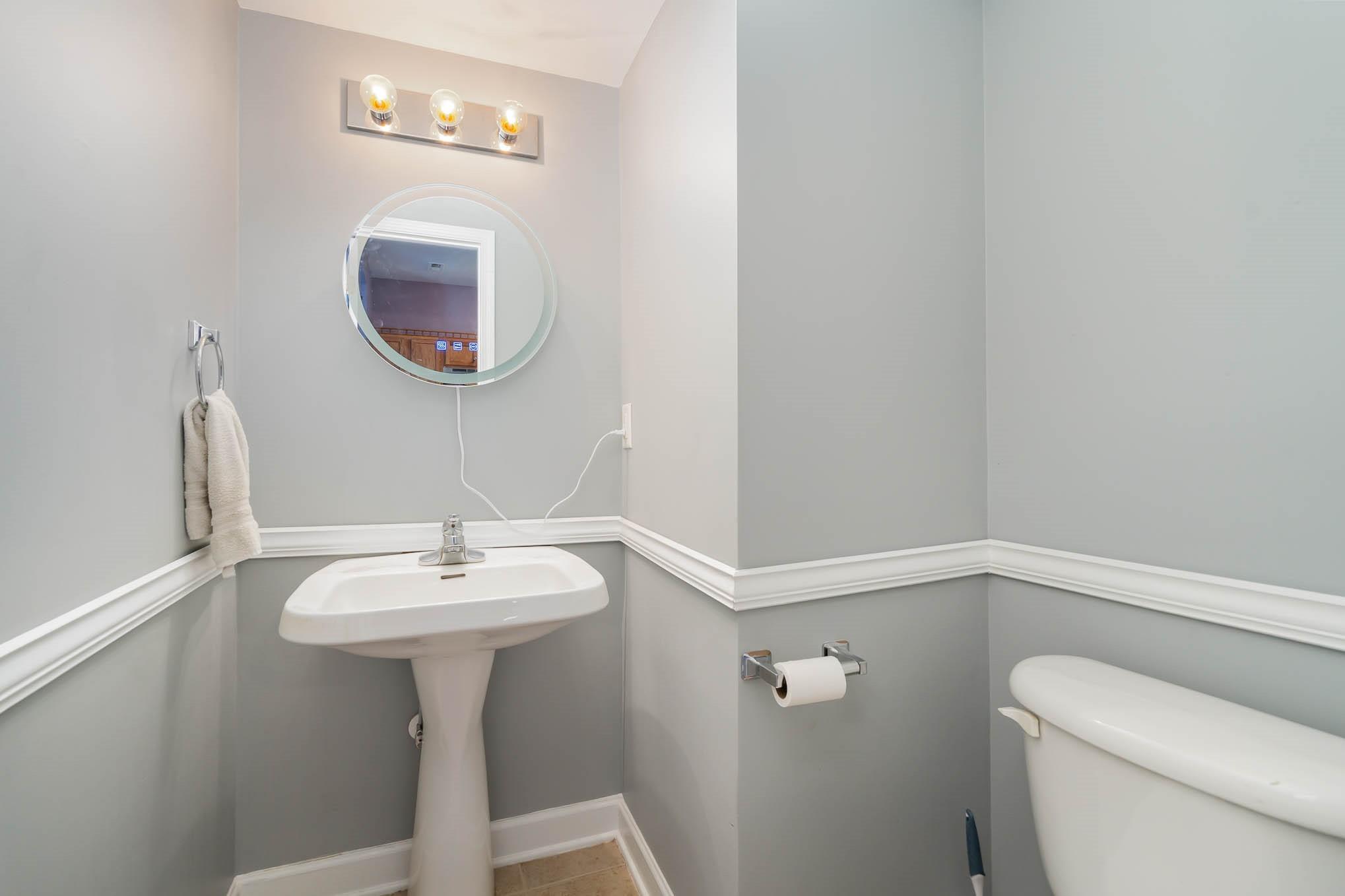 12832 Windyedge Road Huntersville, NC 28078 - Photo 14 of 28 a bathroom with a sink a mirror and toilet