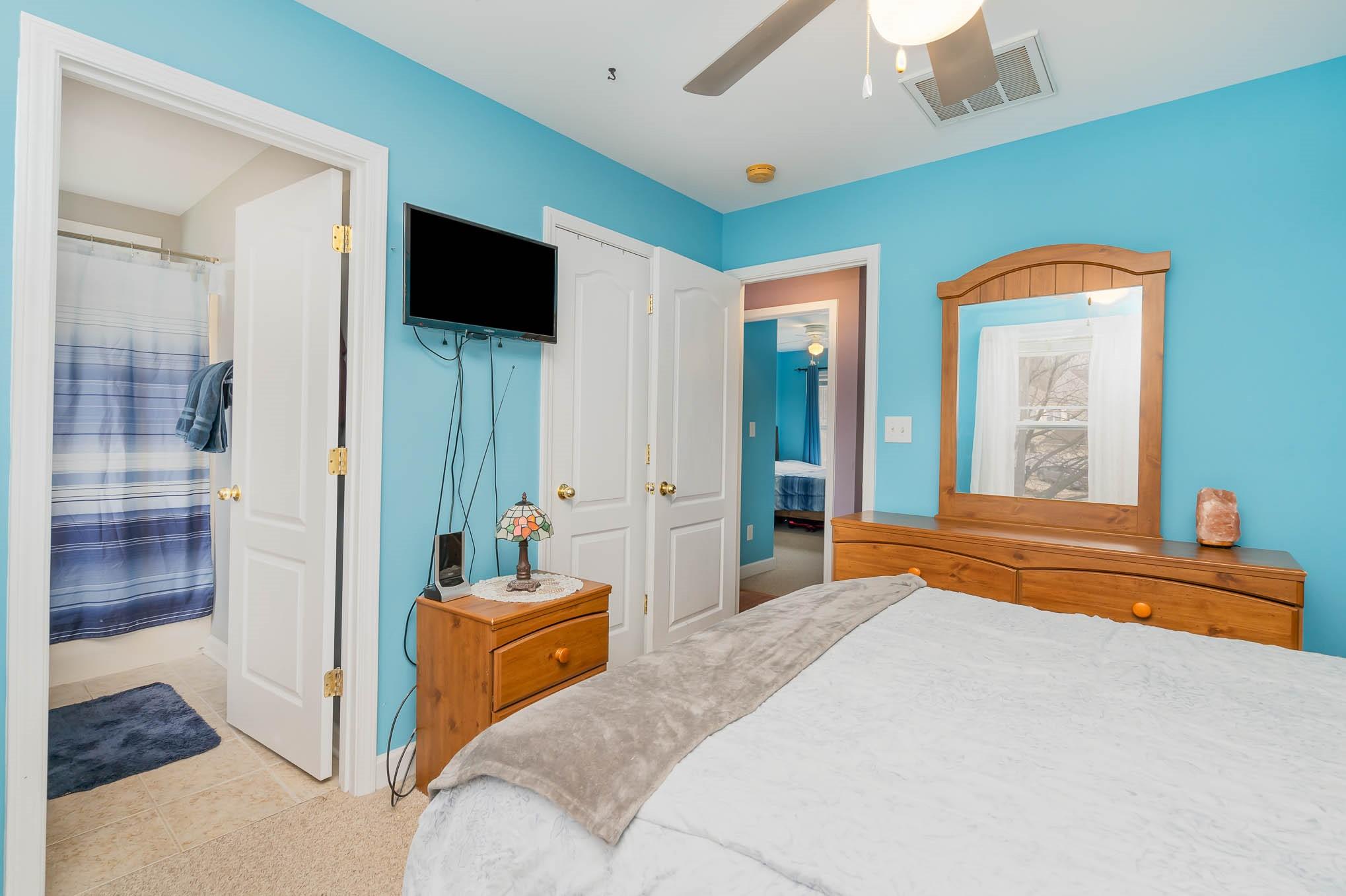 12832 Windyedge Road Huntersville, NC 28078 - Photo 16 of 28 a bedroom with a bed and glass door