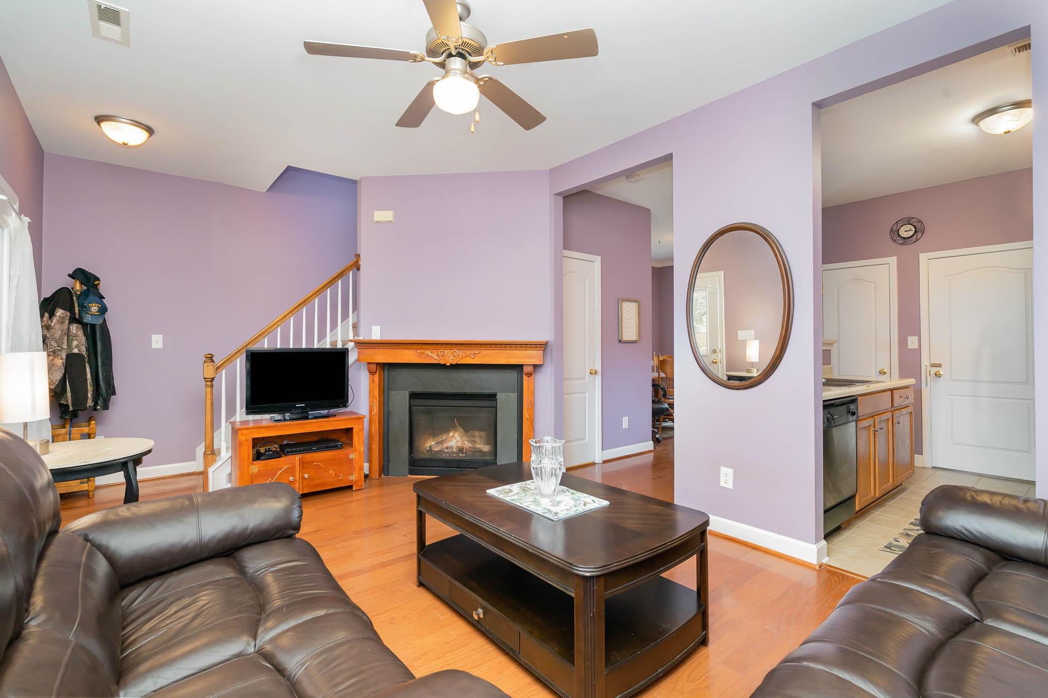 12832 Windyedge Road Huntersville, NC 28078 - Photo 2 of 28 a living room with furniture and a fireplace