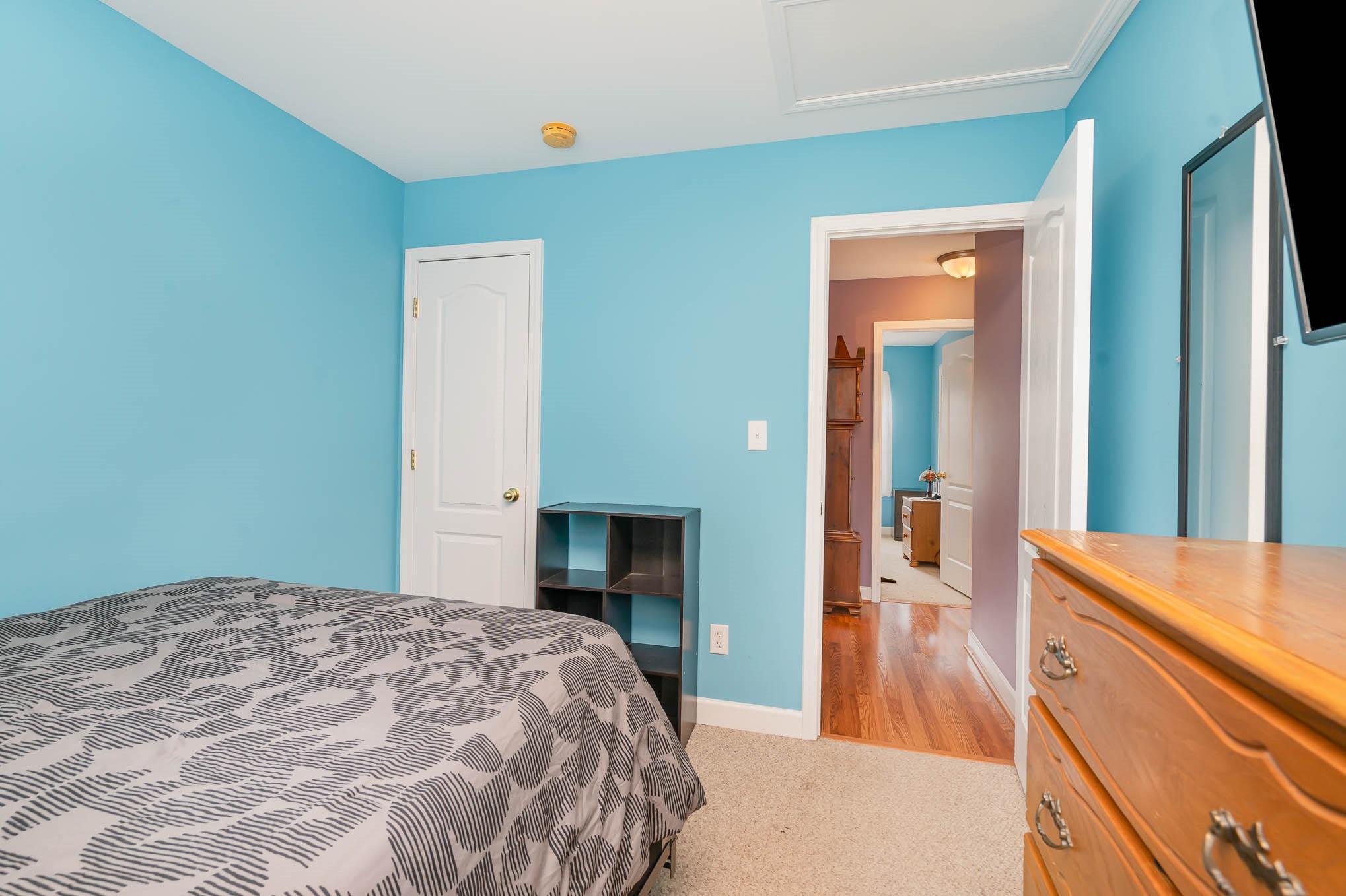 12832 Windyedge Road Huntersville, NC 28078 - Photo 21 of 28 a bedroom with a bed and a dresser
