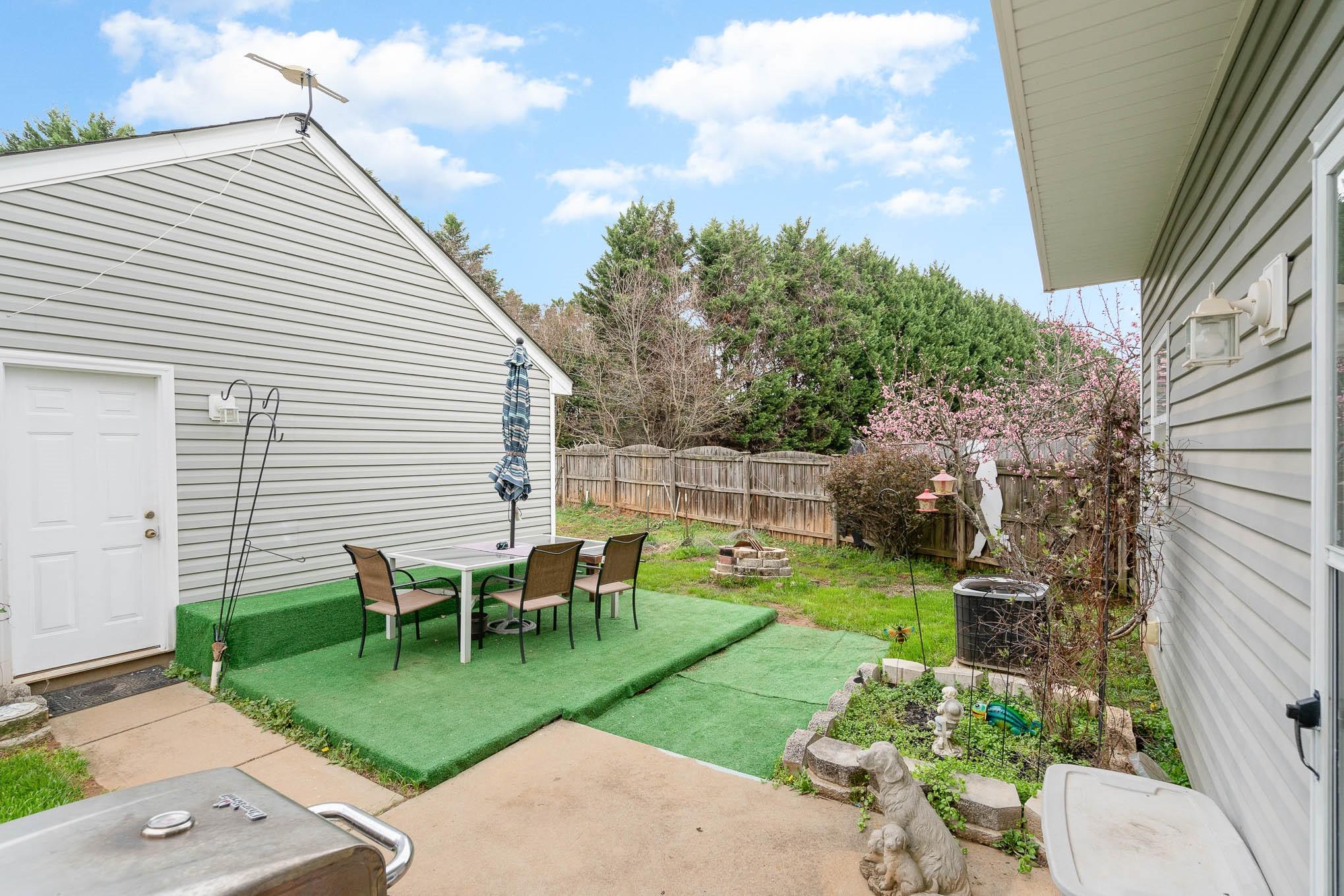 12832 Windyedge Road Huntersville, NC 28078 - Photo 24 of 28 a view of a backyard with sitting area