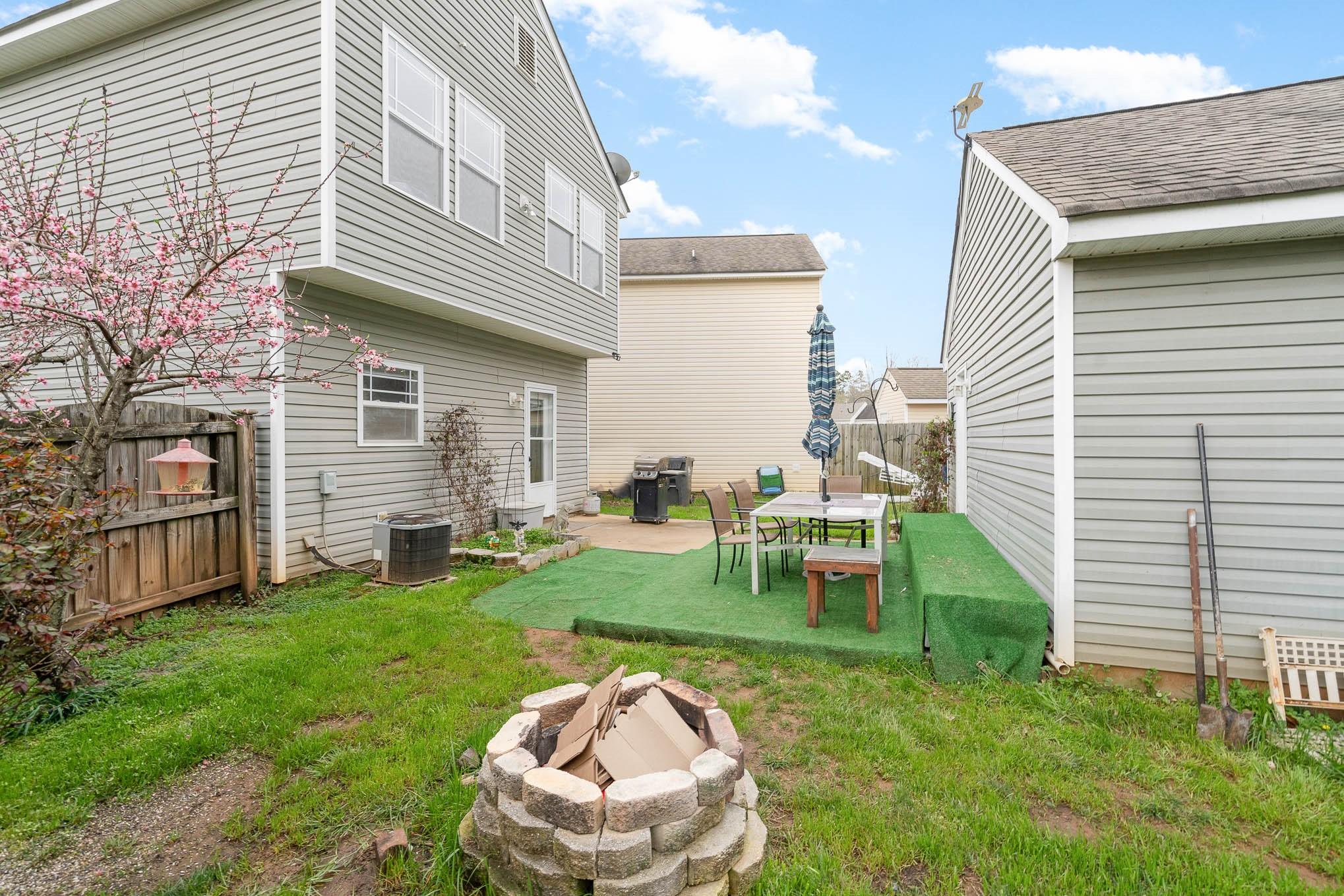 12832 Windyedge Road Huntersville, NC 28078 - Photo 25 of 28 a backyard of a house with table and chairs