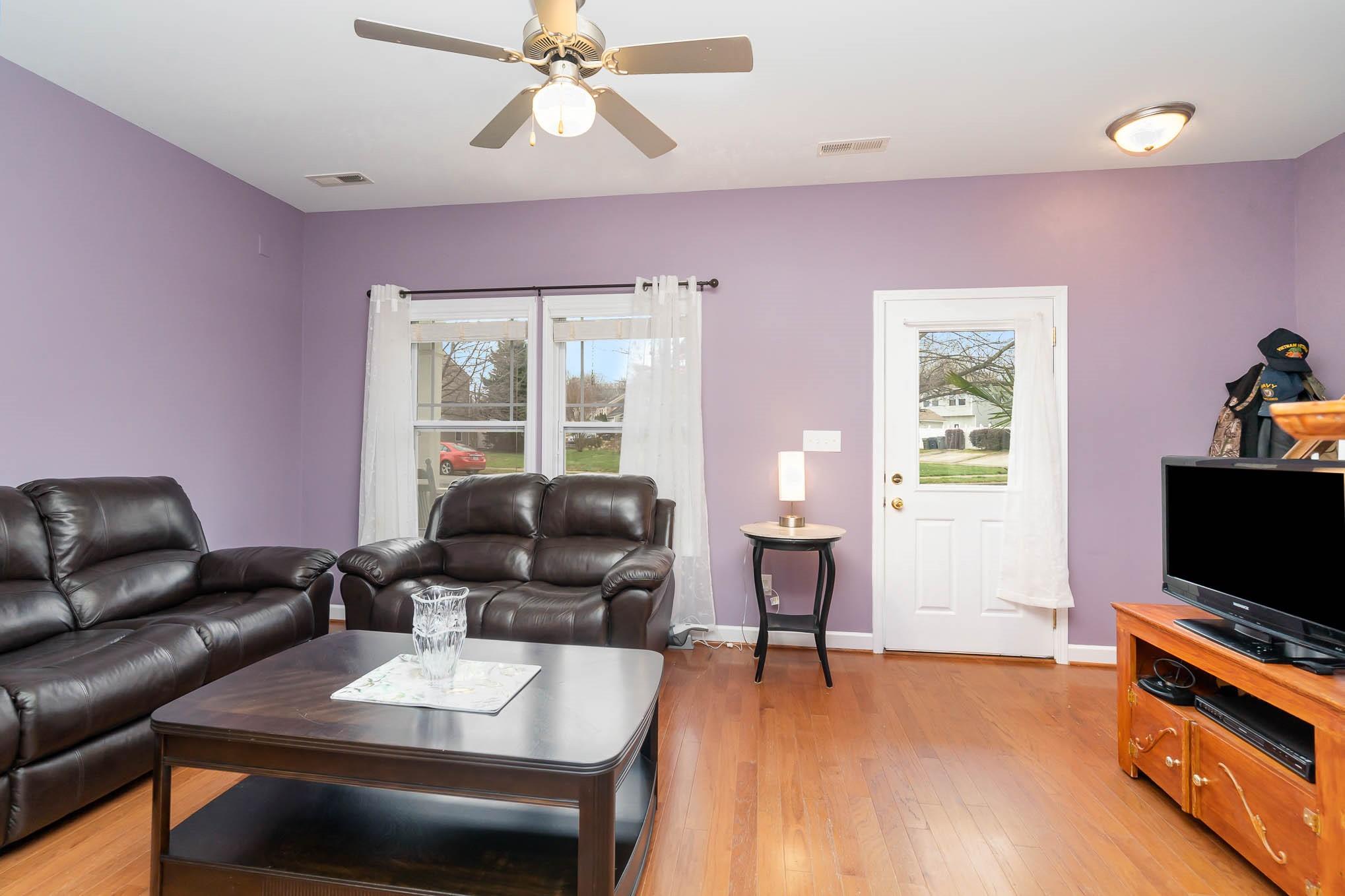 12832 Windyedge Road Huntersville, NC 28078 - Photo 9 of 28 a living room with furniture and a flat screen tv