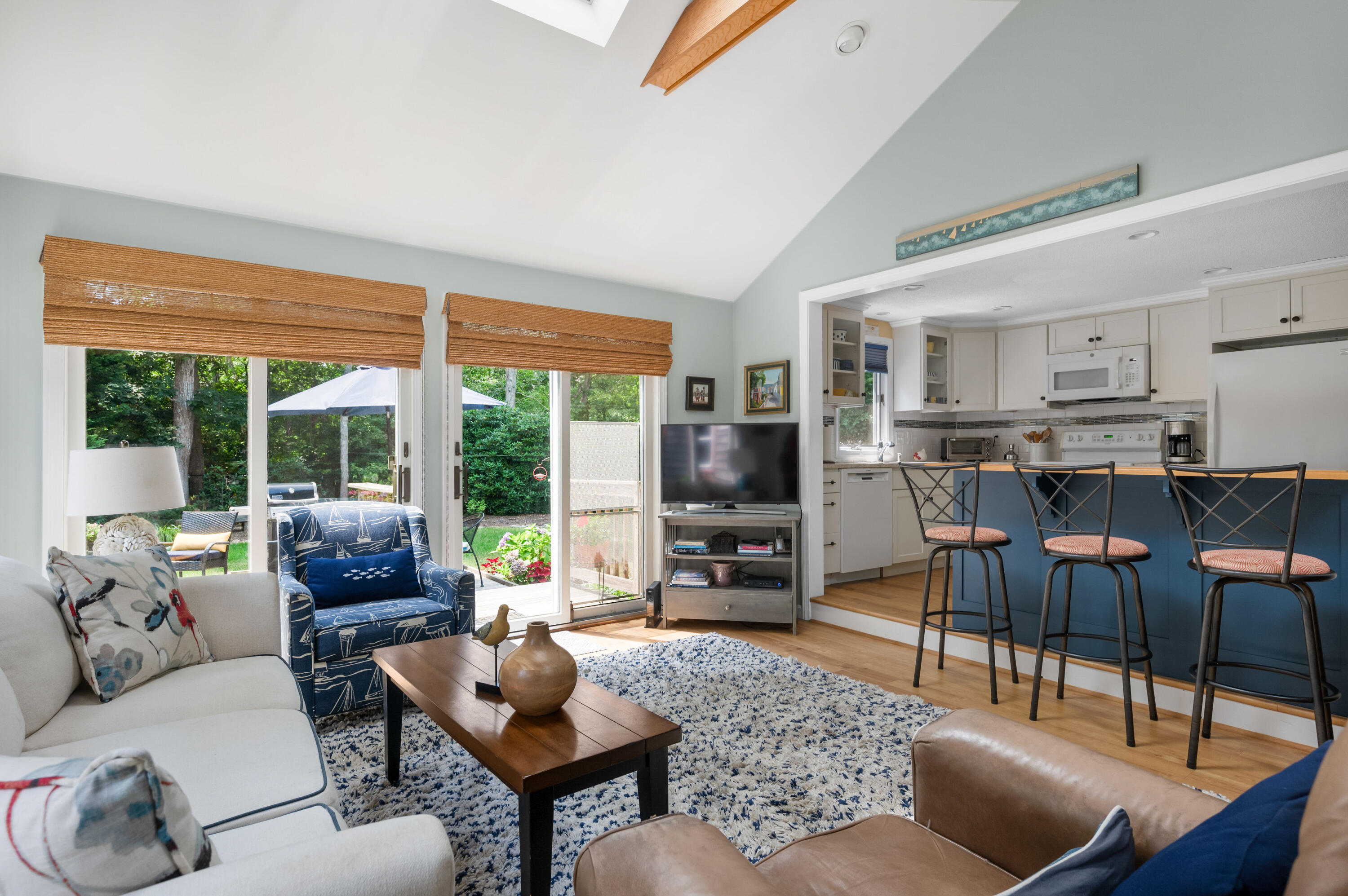 25 Massasoit Trail Eastham, MA 02642 - Photo 11 of 28 a living room with furniture and a flat screen tv
