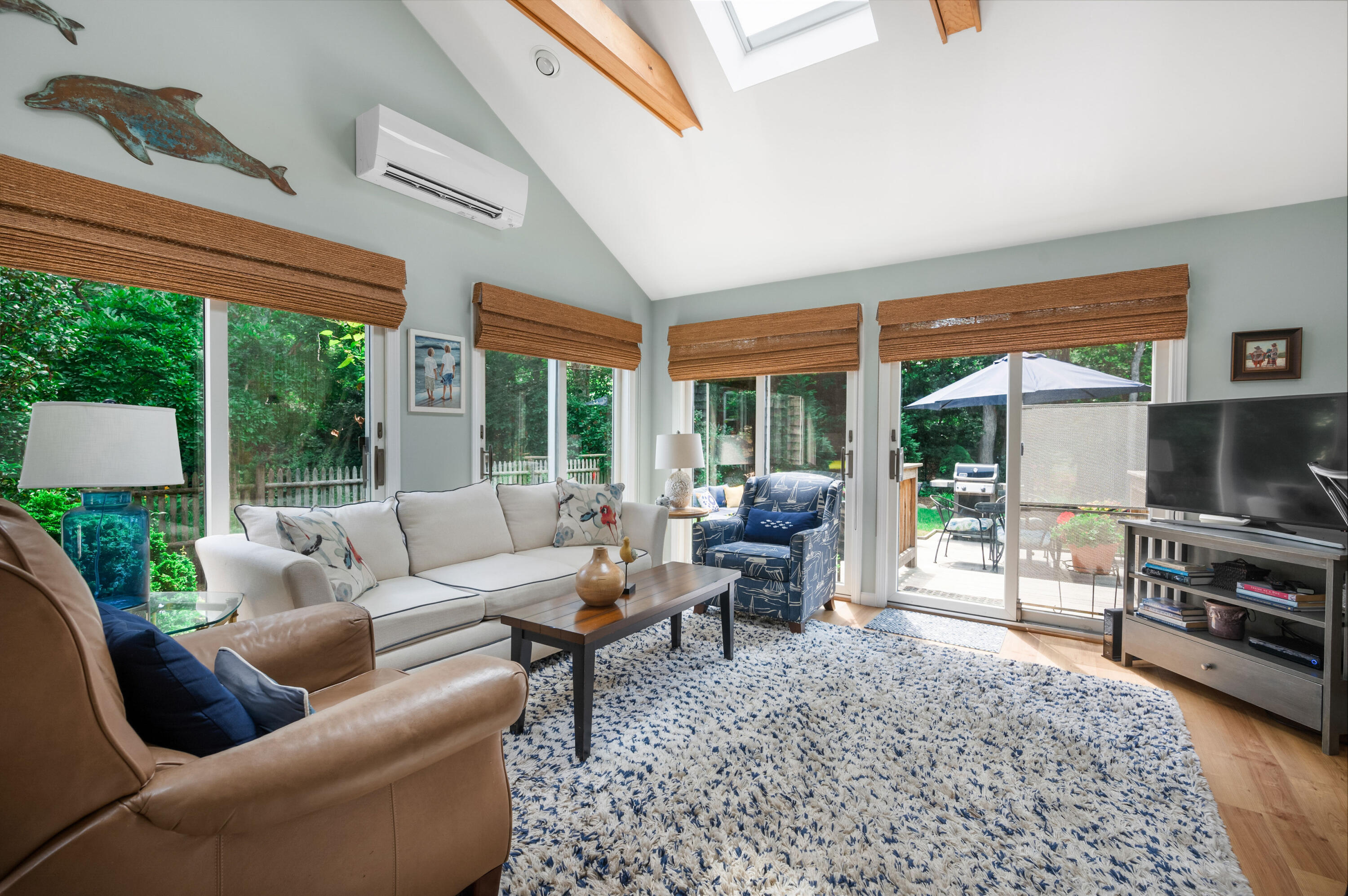 25 Massasoit Trail Eastham, MA 02642 - Photo 13 of 28 a living room with furniture tv and a table