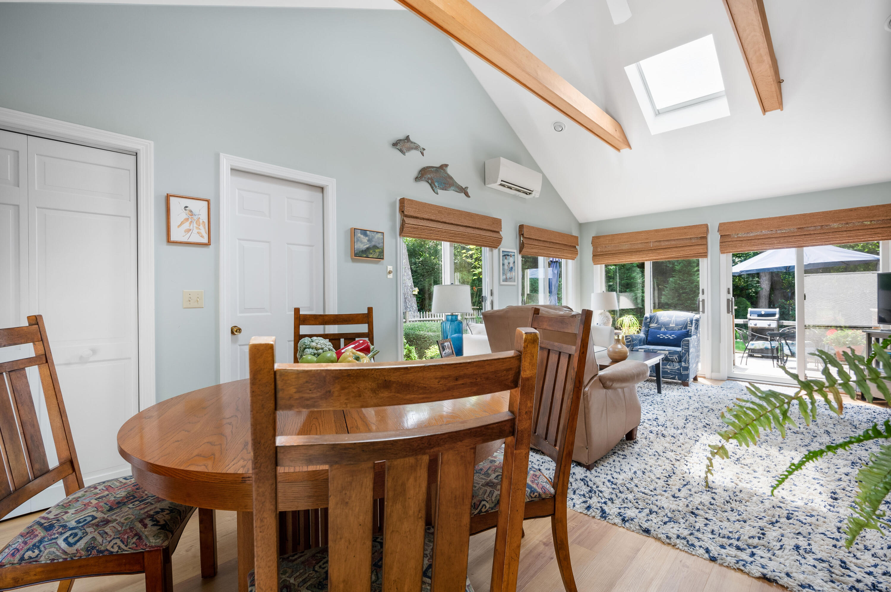 25 Massasoit Trail Eastham, MA 02642 - Photo 14 of 28 a view of a dining room with furniture window and outside view