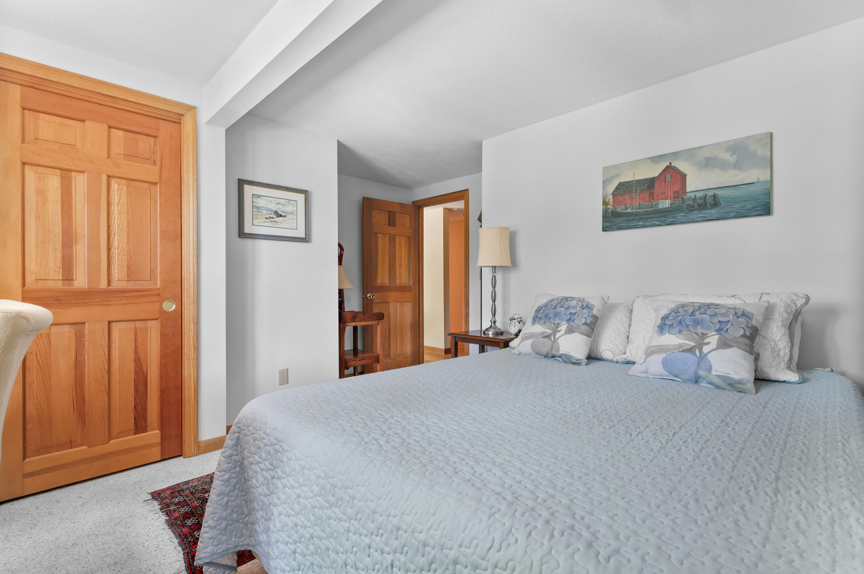 25 Massasoit Trail Eastham, MA 02642 - Photo 19 of 28 a bedroom with a large bed and a window