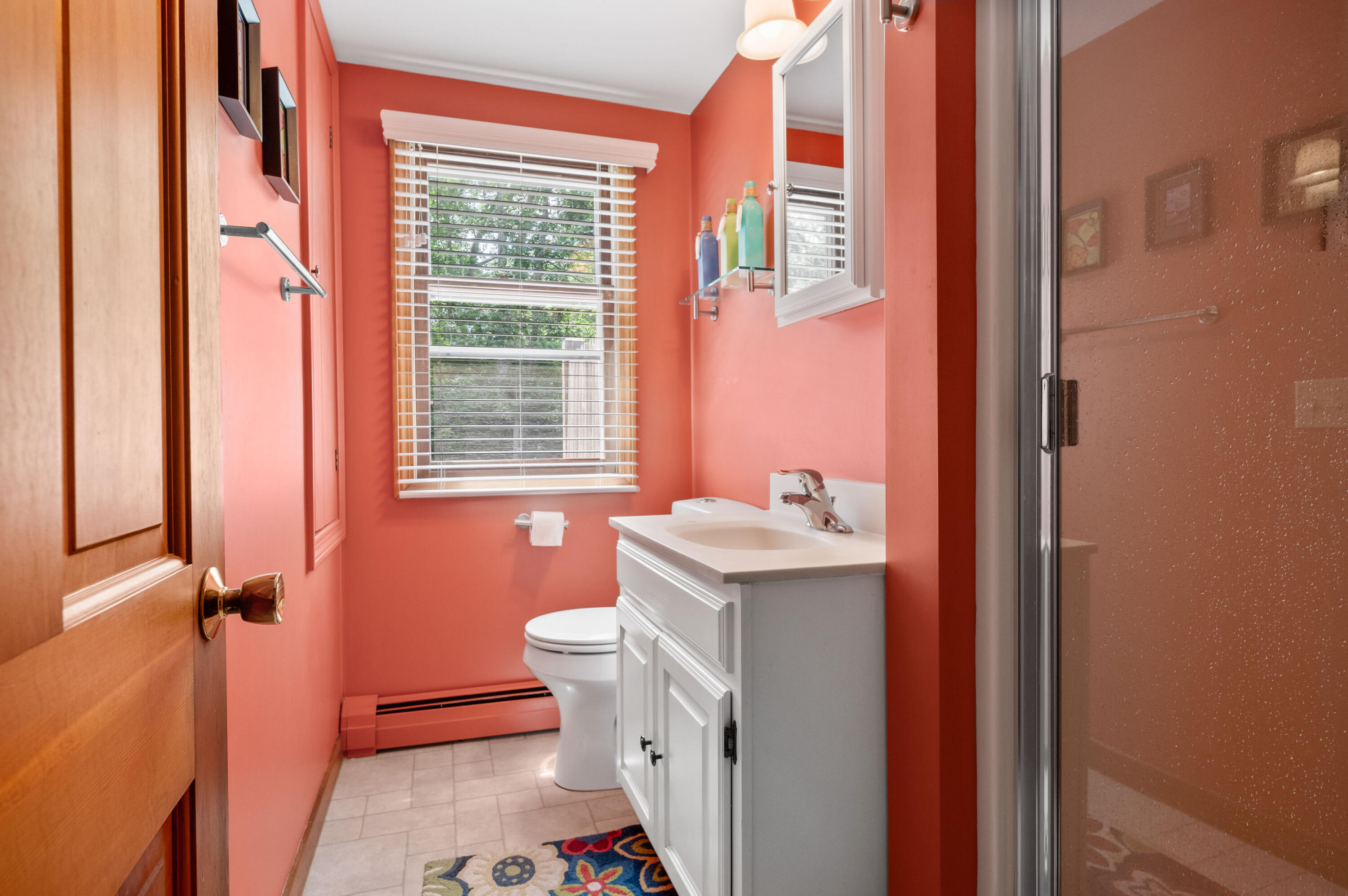 25 Massasoit Trail Eastham, MA 02642 - Photo 20 of 28 a bathroom with a granite countertop toilet a sink and a window