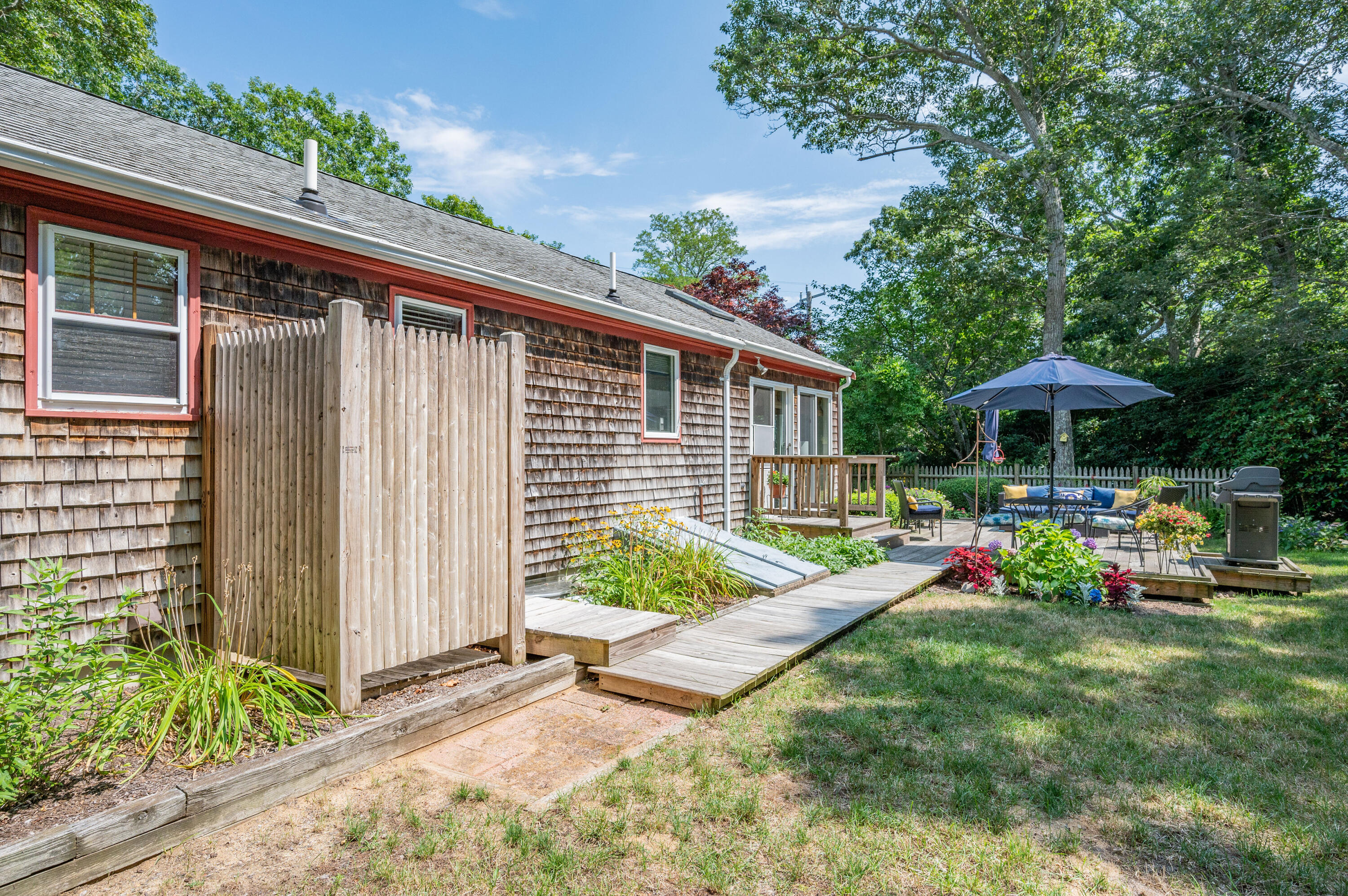 25 Massasoit Trail Eastham, MA 02642 - Photo 25 of 28 a view of backyard with deck and seating space