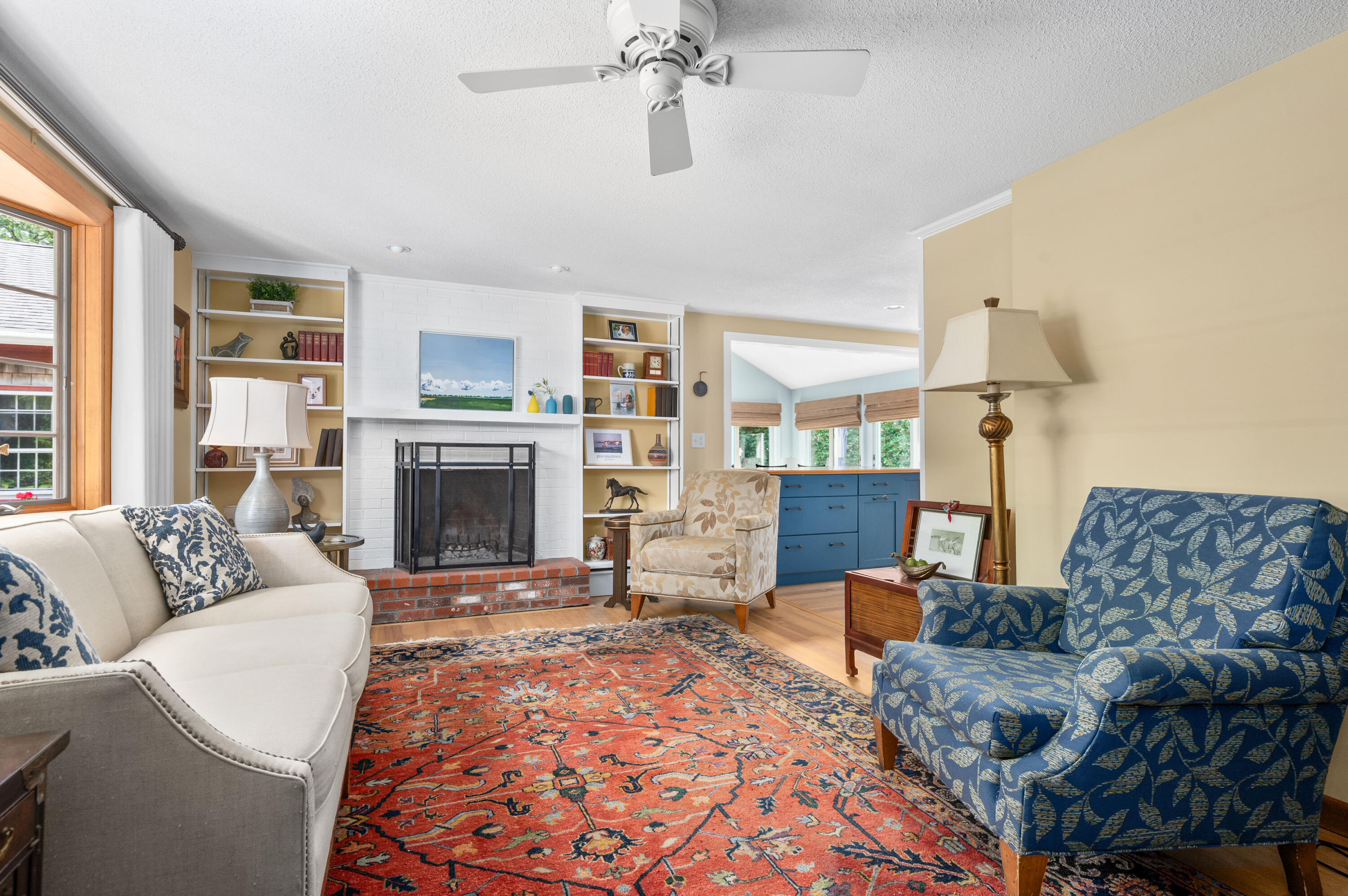 25 Massasoit Trail Eastham, MA 02642 - Photo 7 of 28 a living room with furniture and a fireplace